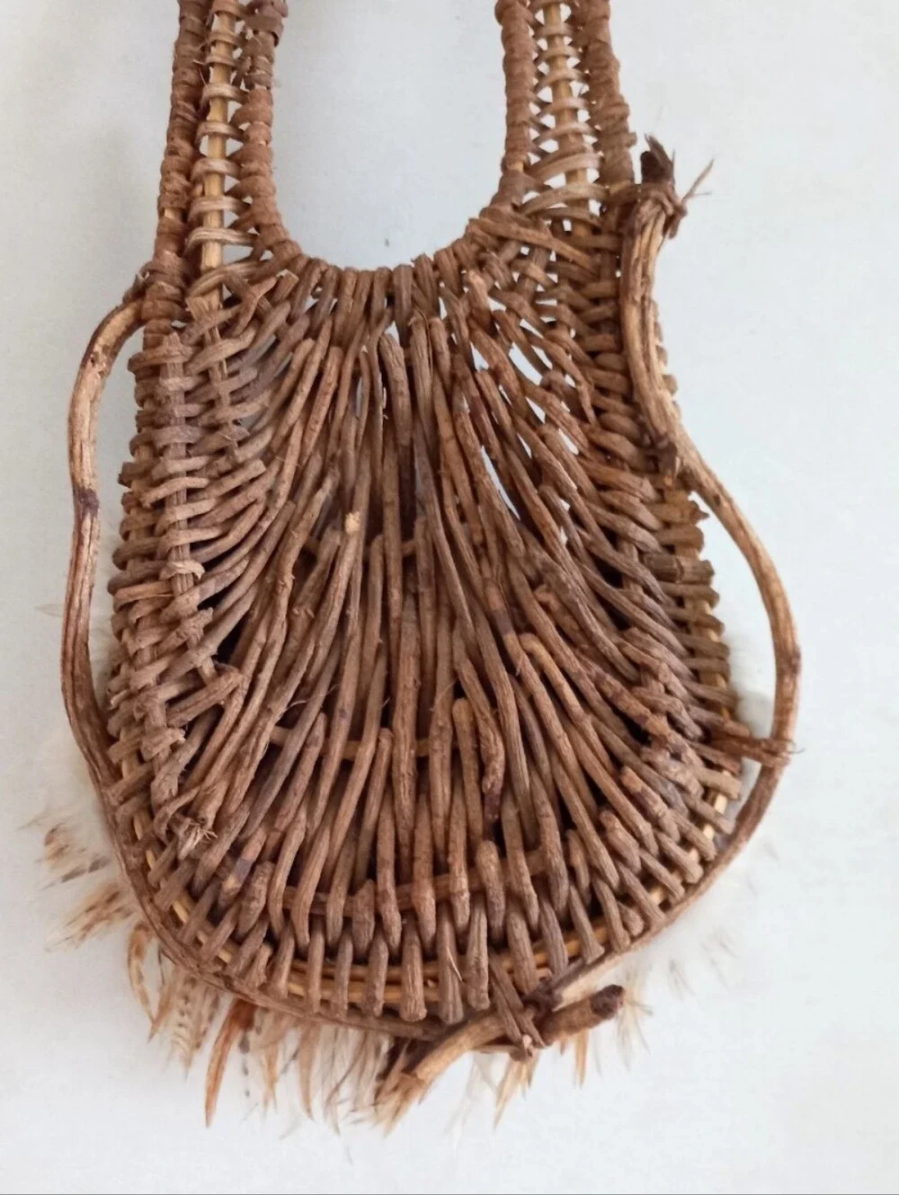 Indigenous Native American vintage natural wicker and feather wall basket